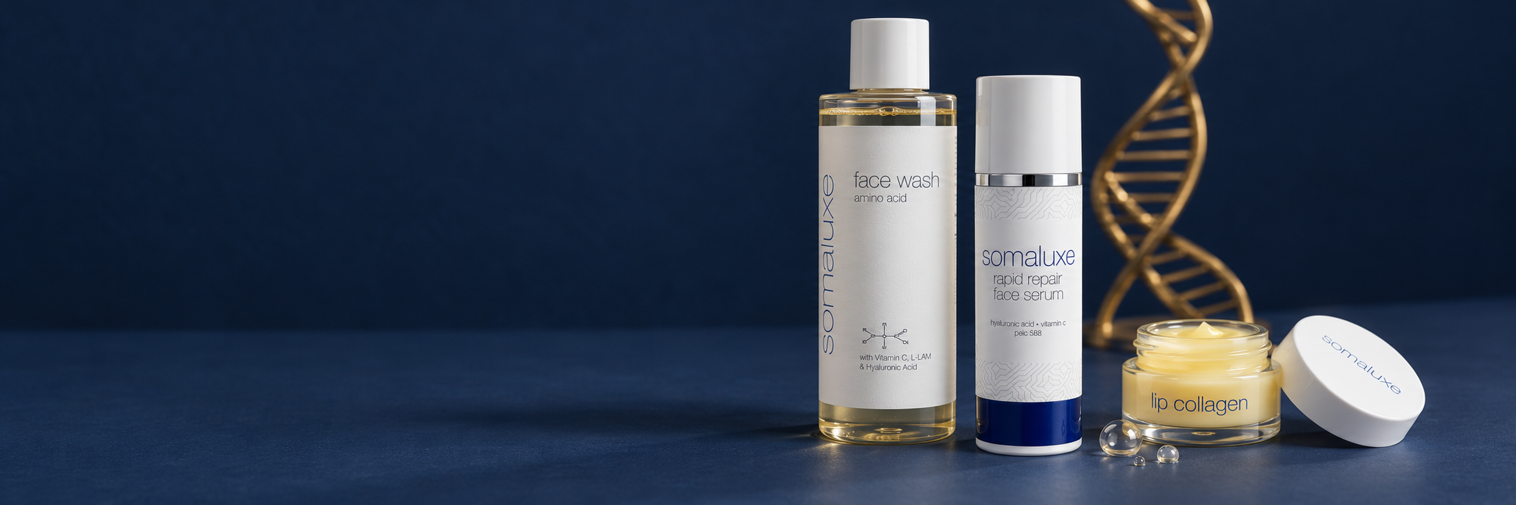 Somaluxe face wash, rapid repair face serum and lip collagen on a navy background with a gold helix